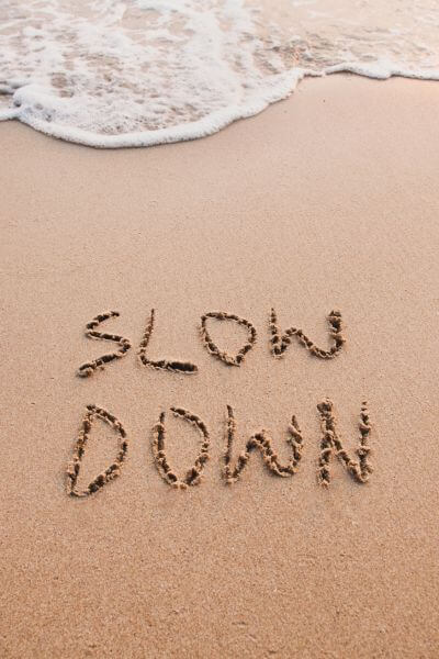 nd-affirming therapist slow down written in sand