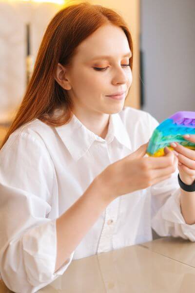 sensory systems woman with stimming tool