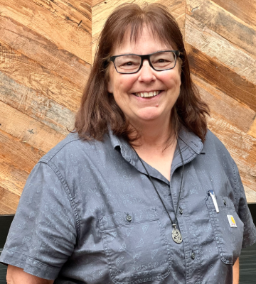 Woman at an autism conference about Autistic adults