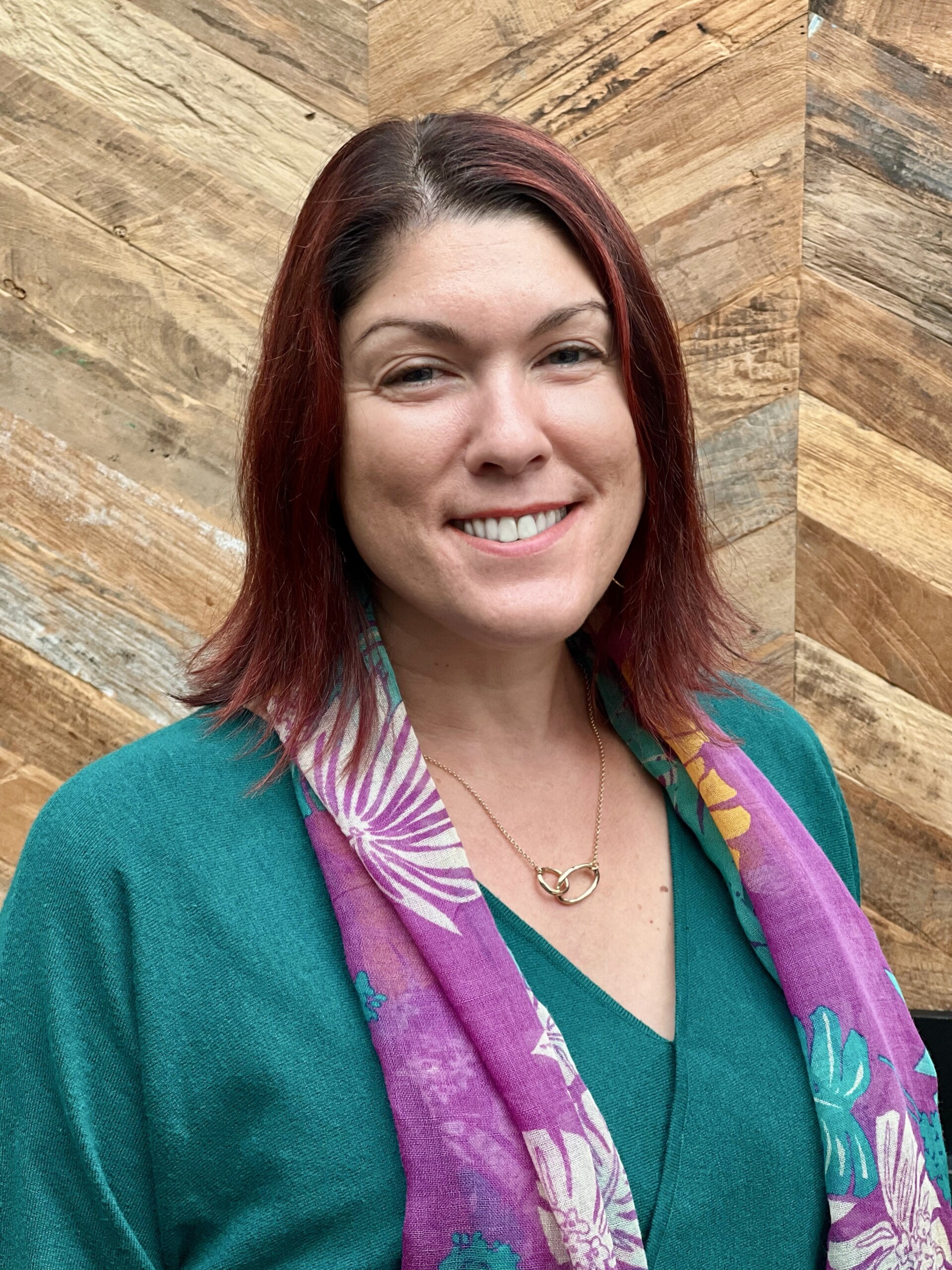 Woman at an autism conference about Autistic adults